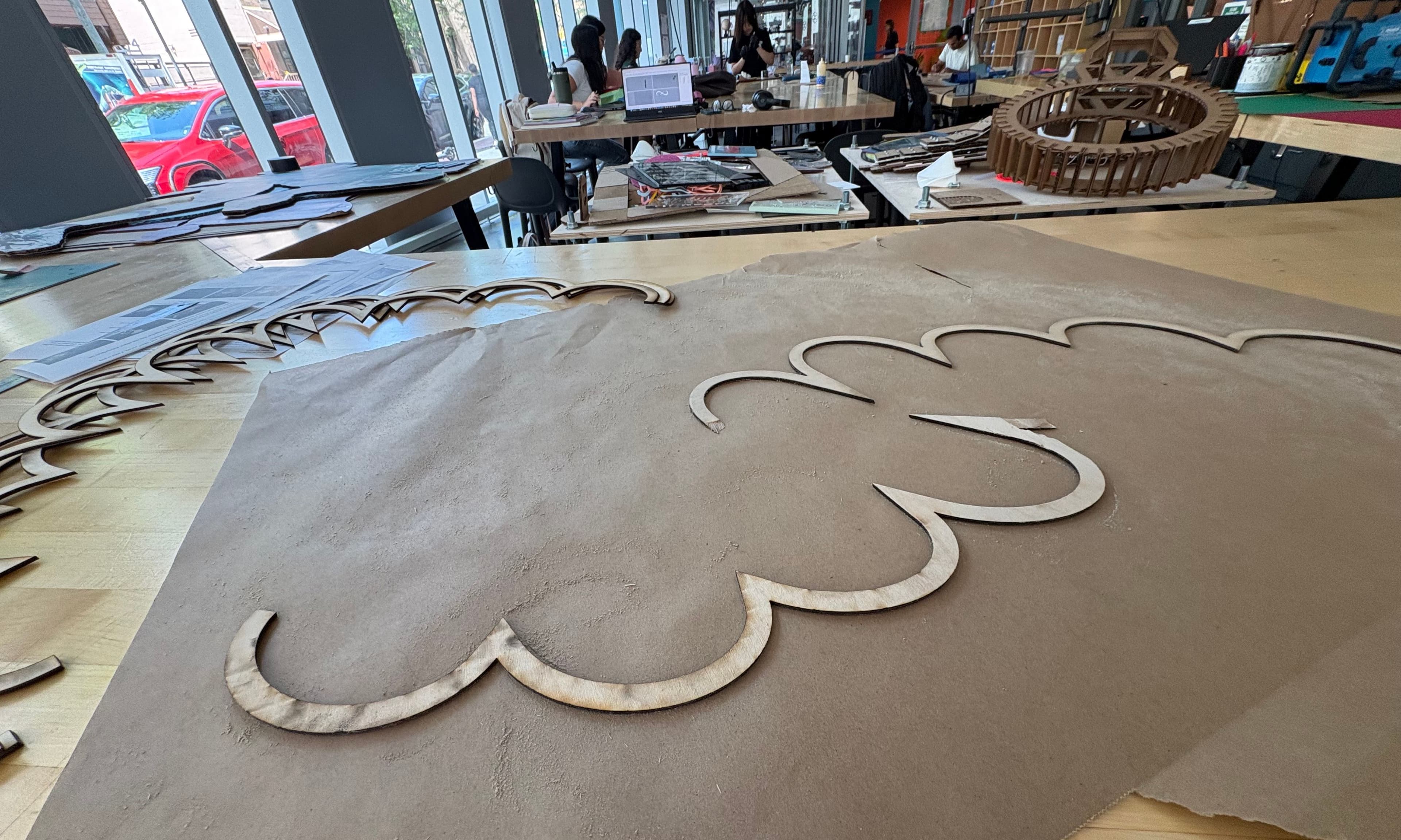 Laser-cut wooden contour pieces during fabrication