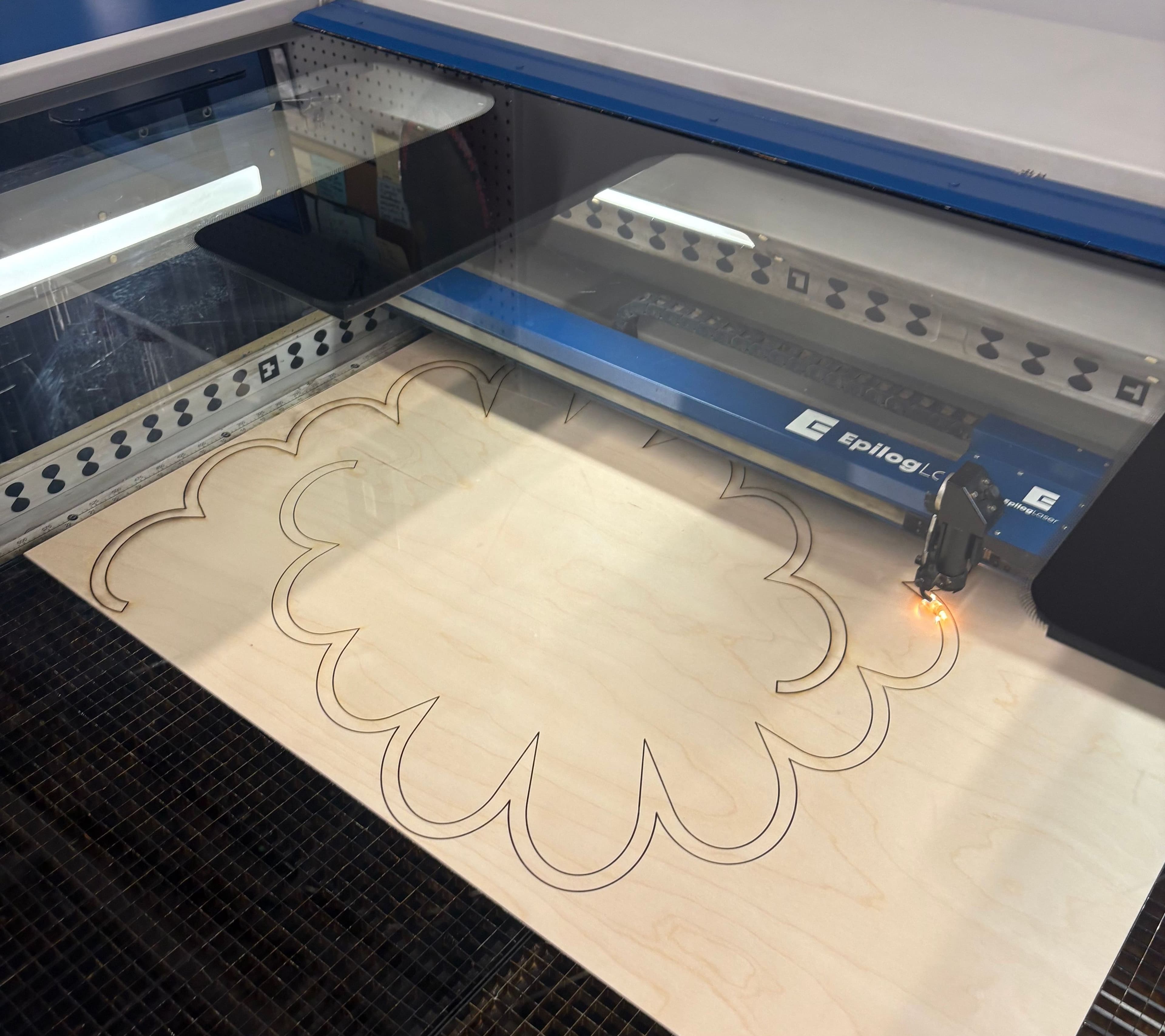 Wood components being cut on the laser cutter