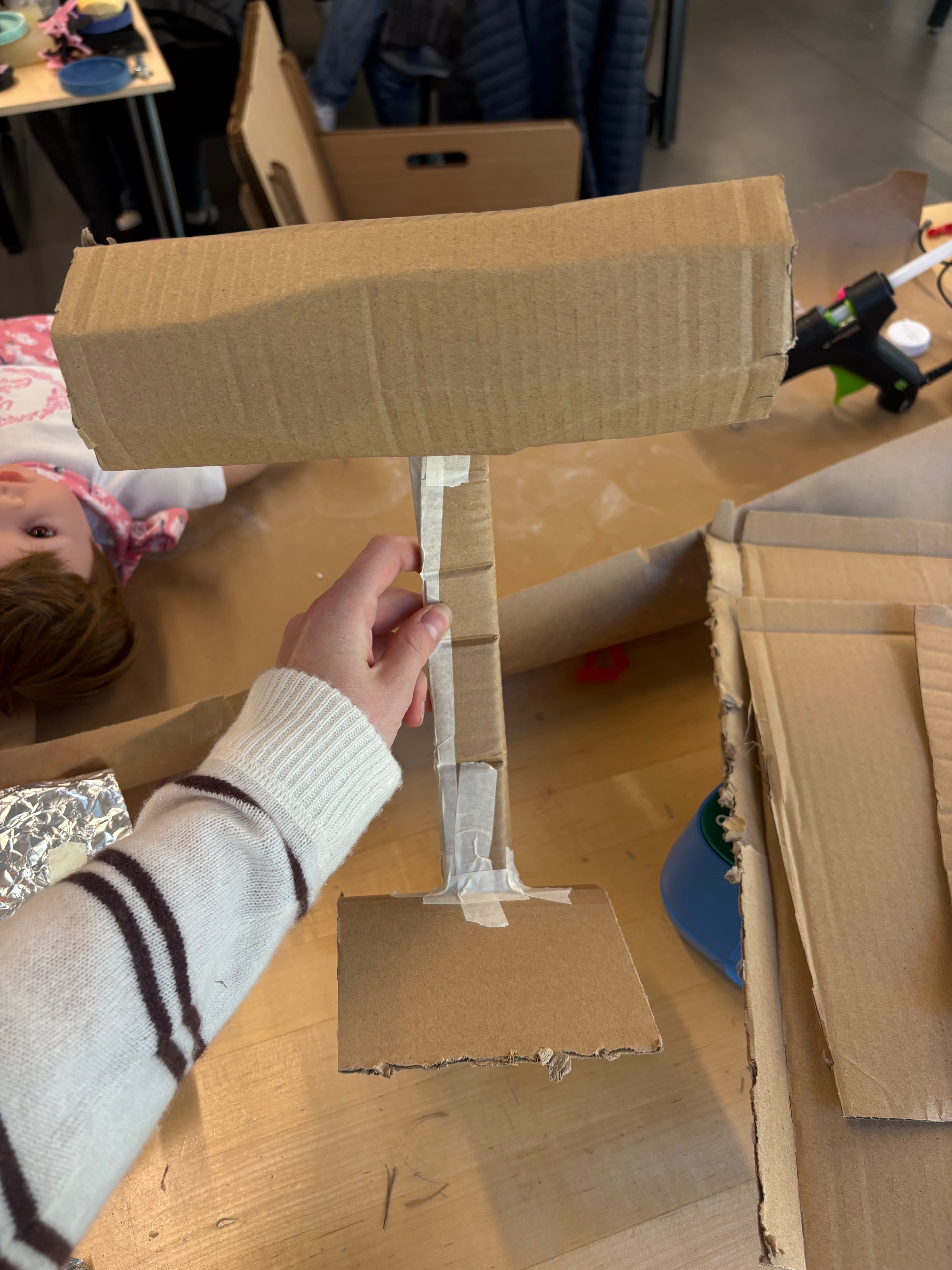 Cardboard Fermata sketch model exploring support structure and lamp housing