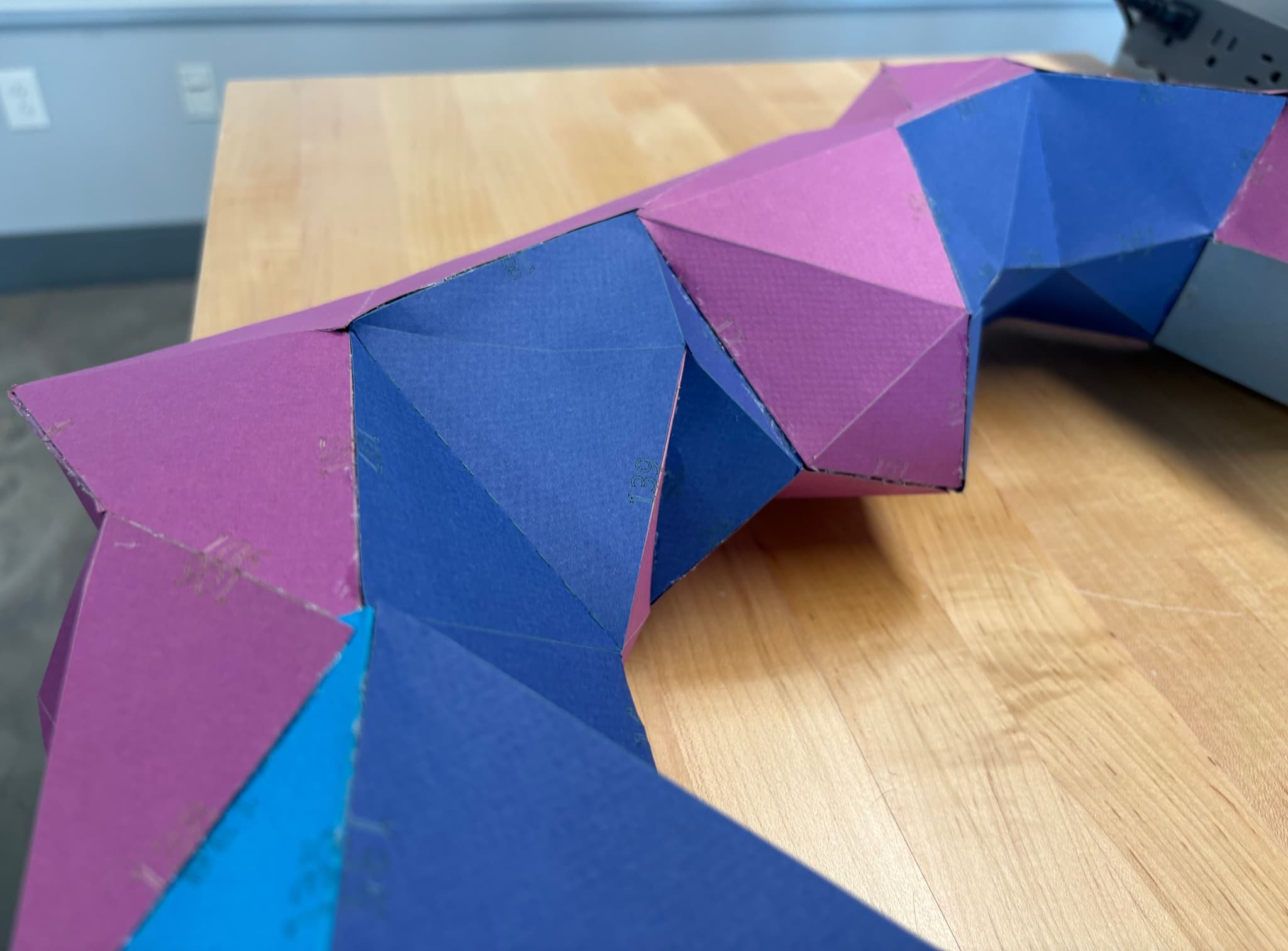 Close-up of folded paper surfaces and seams